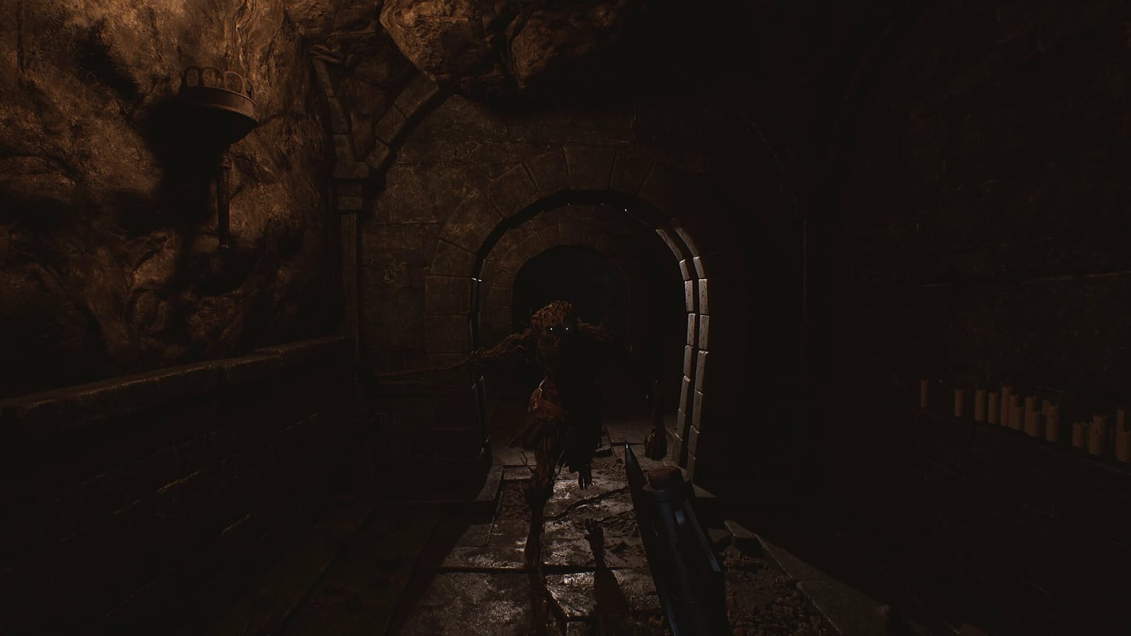 Among the Trolls — a troll charges down a candle-lit stone tunnel